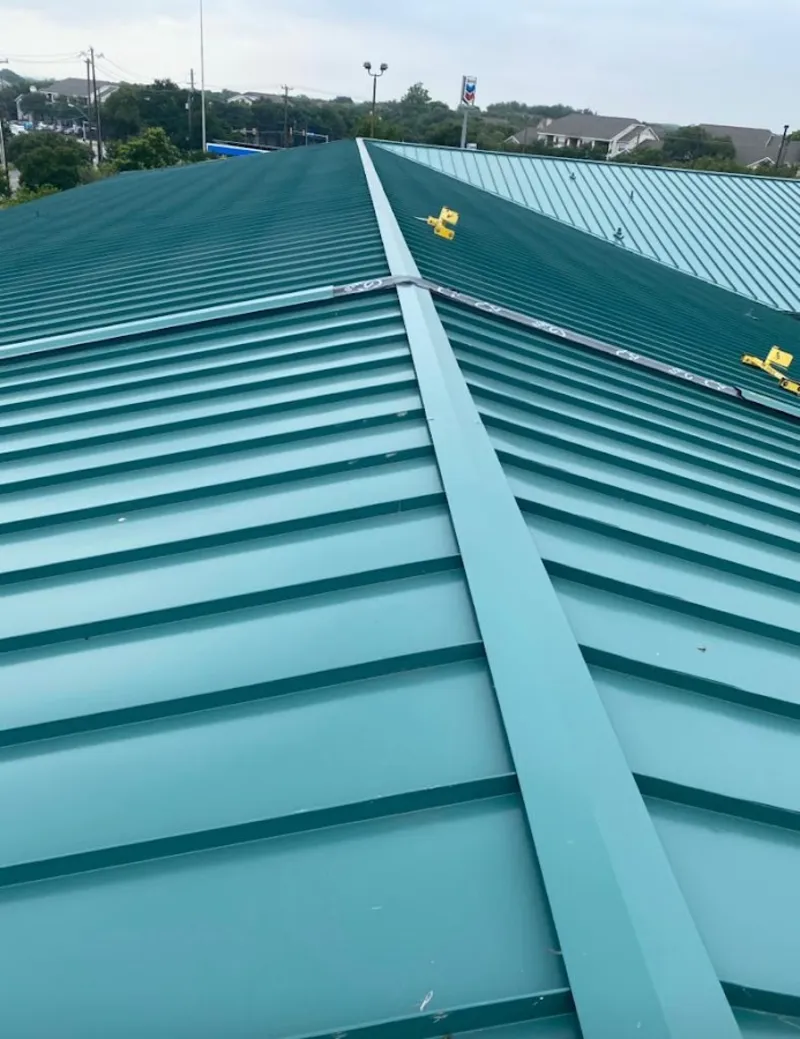 Green commercial metal roof ridge and valley for Metal Roof Repair in Swannanoa